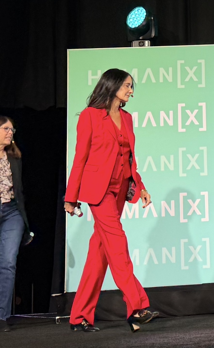 Lara Shackelford walking on stage at HumanX 2026