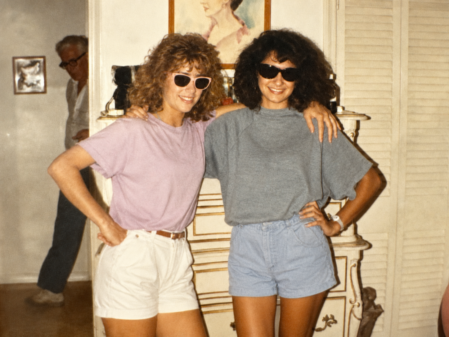 Two teenage friends posing together in Dallas in the late 1980s